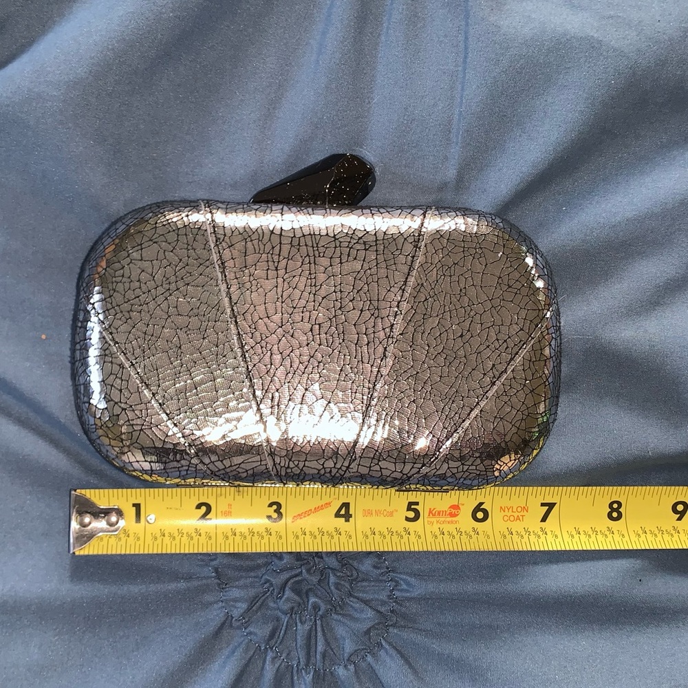 Silver & black hard sided clutch with long chain strap